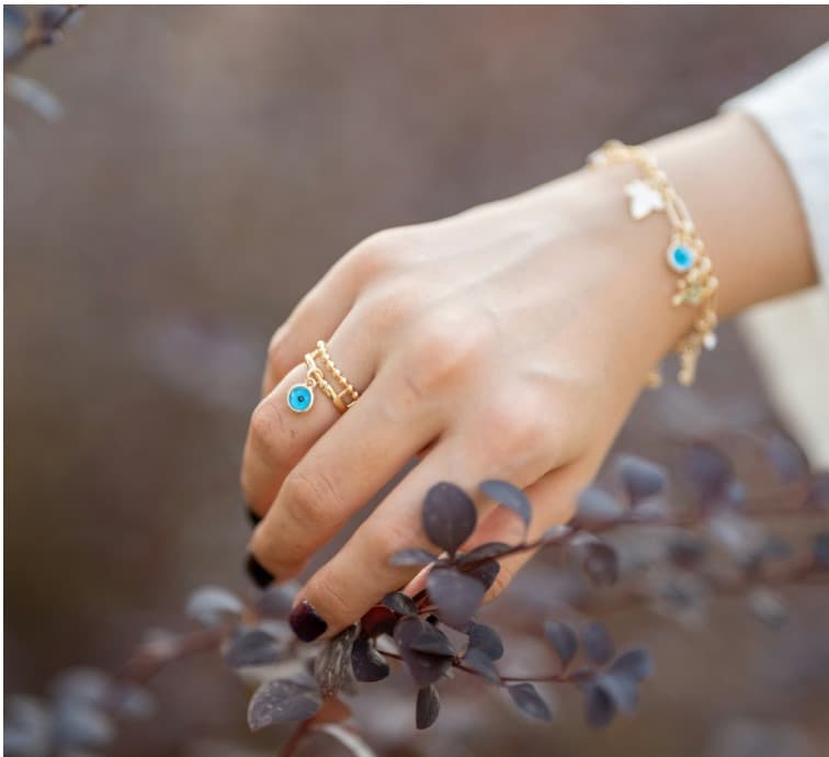 Hand wearing handcrafted bracelet and ring